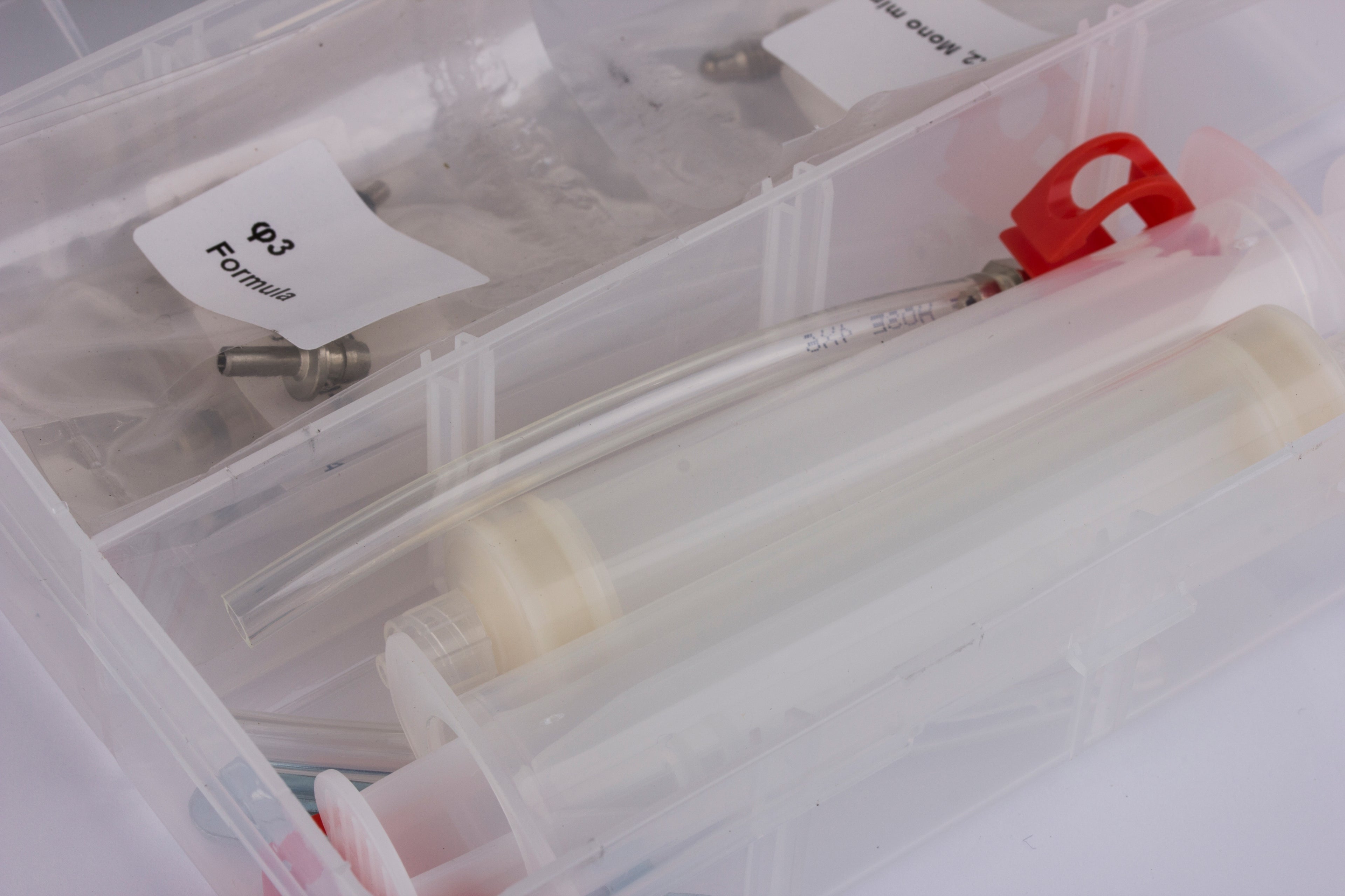 Universal bleed kit with syringe and nipples to suit most brands